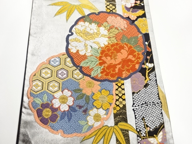  作家物　雪輪に花々・蝶・竹模様織出し袋帯